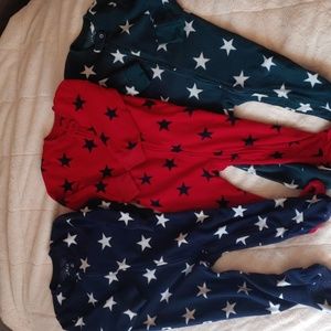 Fleece onsie pajamas by Primary selling as a 3 pack set for $30